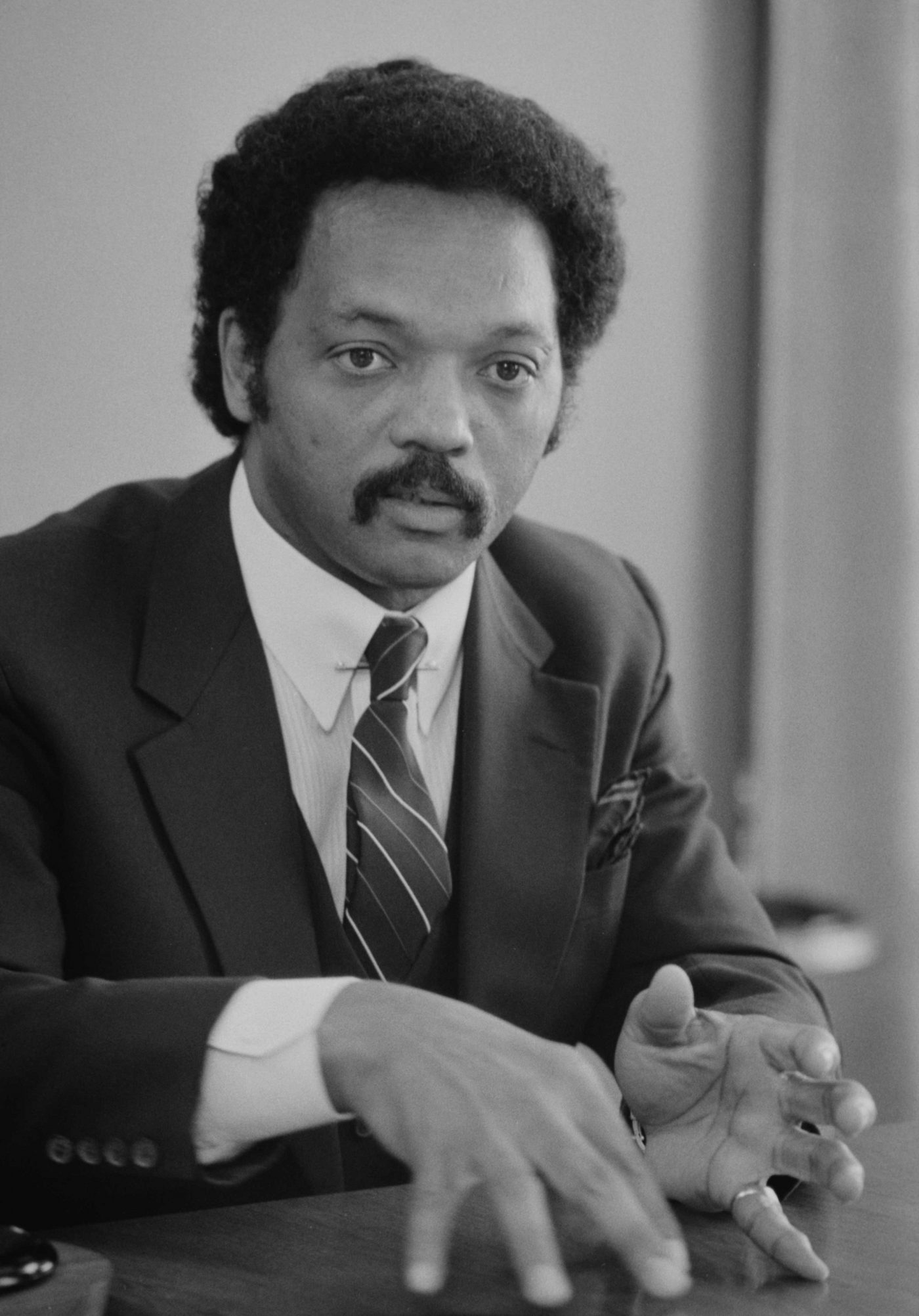 Black-and-white portrait of a young Jesse Jackson